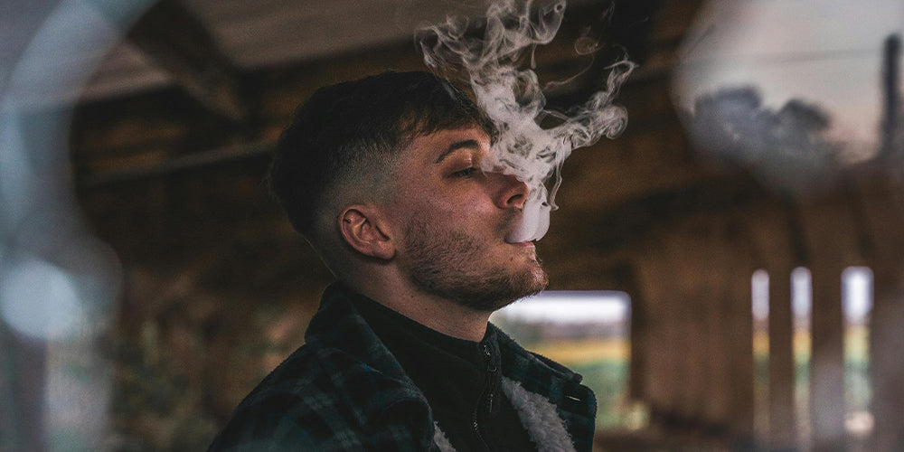 Man Exhaling Vapor