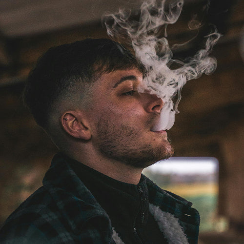 Man Exhaling Vapor