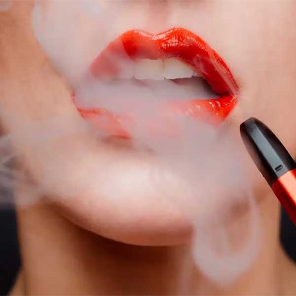 Woman Vaping Showing Teeth